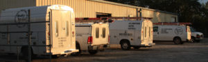 QSC trucks and shop.