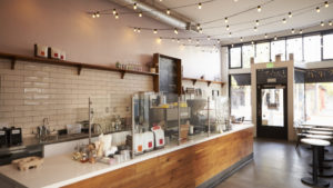 Empty cafe interior, daytime.
