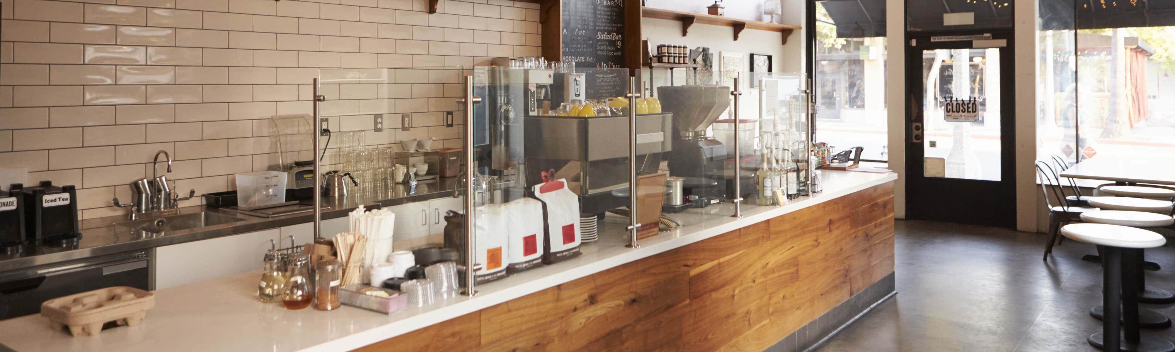 Empty cafe interior, daytime.