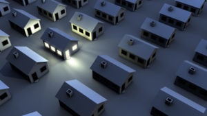 3D rendering of mulitple houses; only one has lights on.