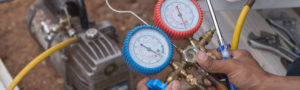 Vacuum pump evacuates air from the air conditioner.