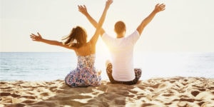 two people on a beach in the summer