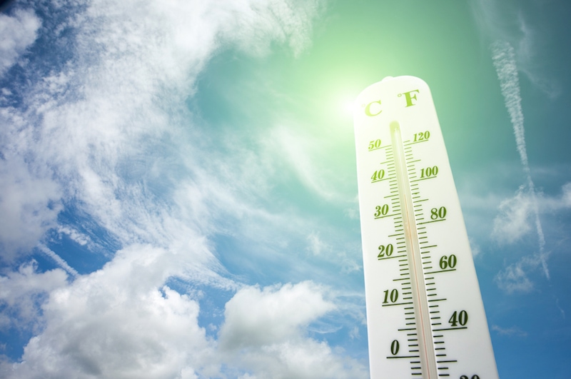 AC blowing hot air in Florence, SC. Picture of a thermometer and a blue sky with white clouds.