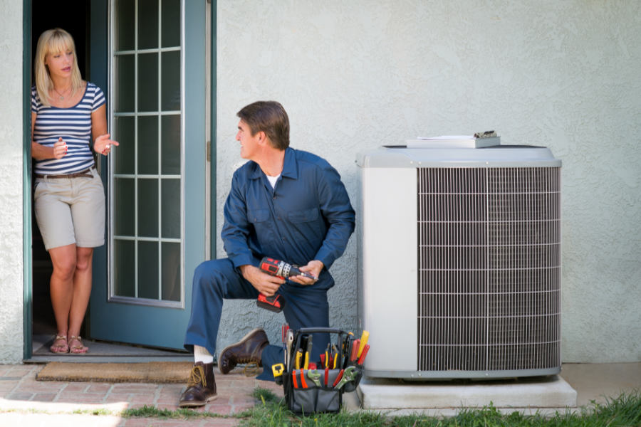 Technician talking to customer about the new AC regulations