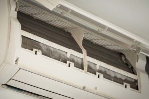 Close up ice on coil cooler of dirty air conditioner.