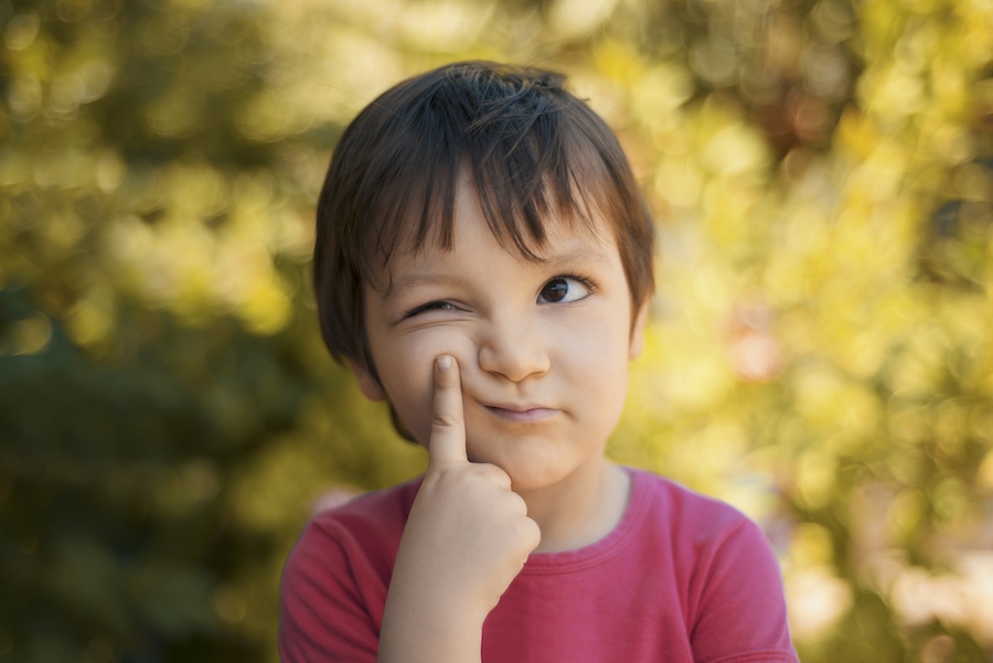 little boy looking confused wondering if getting HVAC preventative maintenance is worth it