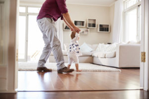 happy father and child in clean room to show how your indoor air quality accessories can help keep you safe.