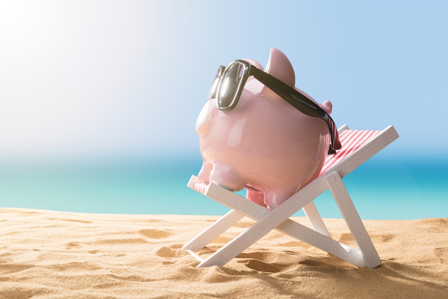 Piggy bank on the beach representing the financing options for affording a new AC system or other HVAC equipment.