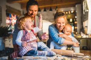 6 ways your furnace keeps you safe, happy family of four baking together