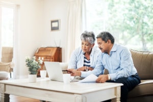 why won't my furnace stop running?, couple doing research on the couch